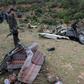 Tunisian security forces check the remains of a bus that plunged over a cliff into a ravine, in Ain Snoussi in northern Tunisia on December 1, 2019 killing 24 people