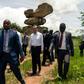 Chinese Foreign Affairs Minister Wang Yi (C) visits the Epworth Balancing Rocks national park in Harare on a visit to Zimbabwe for talks with leaders