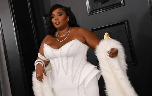 US singer-songwriter Lizzo rocks a Versace corset gown at the Grammys