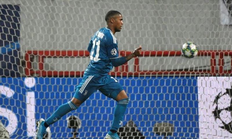 Juventus forward Douglas Costa celebrates after scoring his first goal this season in the Champions League in Moscow.