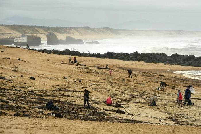People on the beach Monday at Capbreton, southwestern France, where packages of cocaine have been found in recent days.