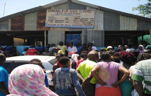 A crowd at the scene where pastor Elijah Misiko of Ground for God’s Gospel 3G Ministries in Mombasa stabbed his wife before committing suicide