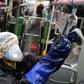 A Tehran municipality worker cleans a bus to avoid the spread of COVID-19