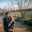 A migrant walks towards the Greek border on Sunday but he can't expect a warm welcome