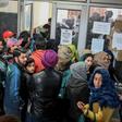 Kashmiri students wait for their turn to use the internet, with only around a dozen kiosks for the region's seven million inhabitants