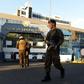 Soldiers guard the El Salvador Legislative Assembly after troops entered and stood guard inside parliament for the first time since the early 1990s during the country's civil war