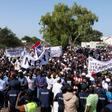 Protesters take part in a demonstration against Gambian President Adama Barrow, calling for him to keep his pledge to quit after three years in office