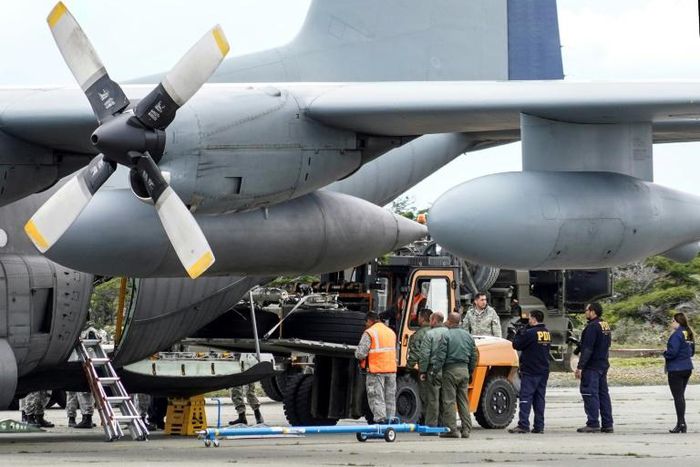 Chilean military personnel on December 13, 2019 offload the landing gear from the Hercules C-130 air force plane that crashed on its way to Antarctica, killing all 38 people on board