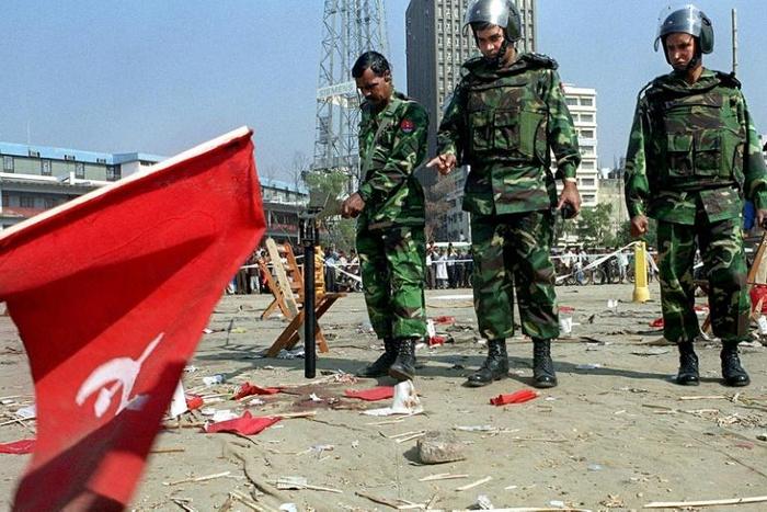 Bangladeshi soldiers inspect the scene of the 2001 bomb blast in Dhaka