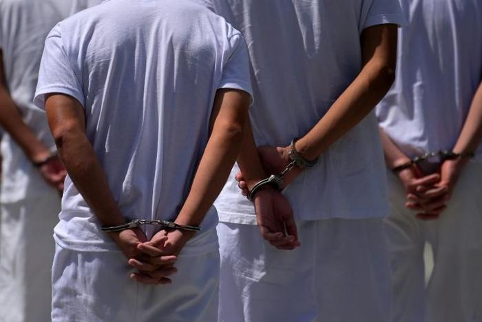 Suspected members of the Barrio 18 gang are pictured at Isidro Menendez Justice Court in San Salvador on February 6