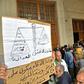 Algerians gather at the entrance of the Sidi M'hamed court in Algiers ahead of the start of a corruption trial for former political leaders and business tycoons
