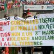 People take part in a January 2020 anti-government rally to protest against President Alpha Conde plans to stay in office for a third term, in Conakry