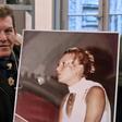 Jacky Kulik holds a portrait of his daughter Elodie who was kidnapped, raped, strangled and her corpse then burned in northern France in January 2002