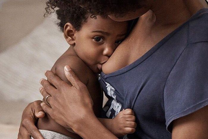 A mother breastfeeding her child