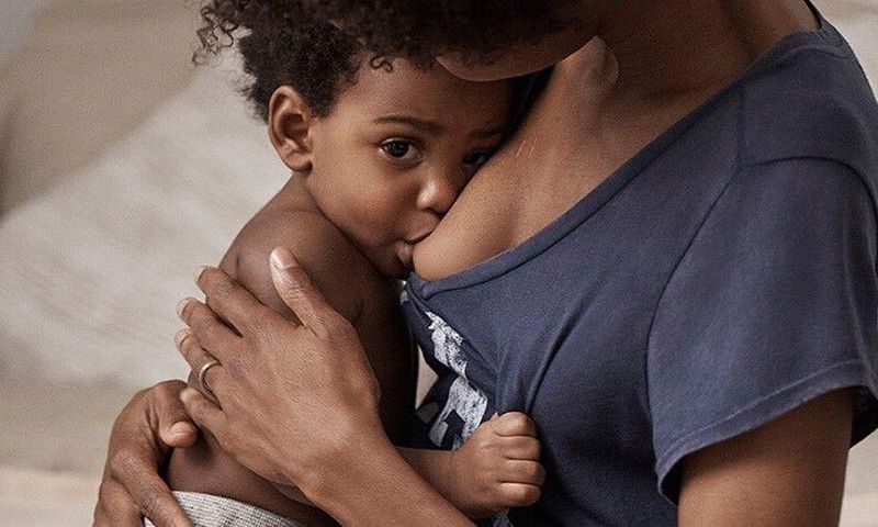 A mother breastfeeding her child