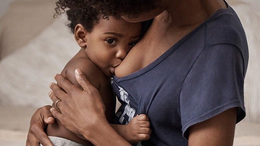 A mother breastfeeding her child