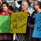 Pakistan human rights activists hold placards during a protest against a suicide blast targeting the Hazara ethnic minority in Lahore in  April 2019