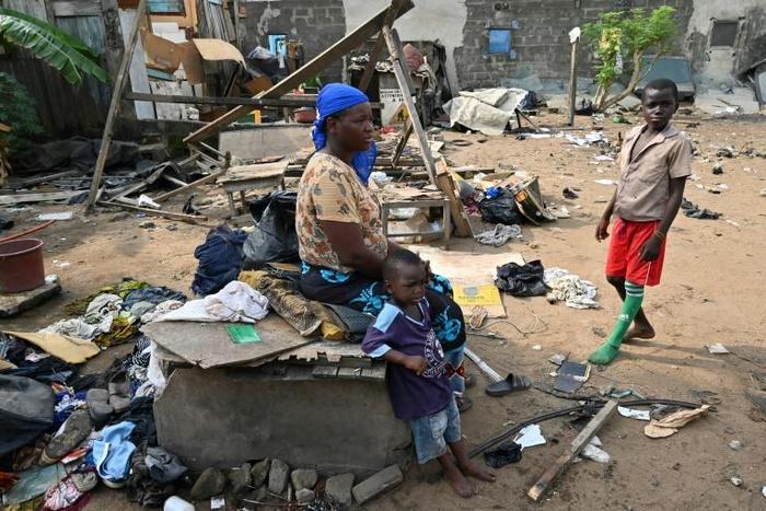 Residents of Adjouffou prepare to leave their homes -- part of the area is being razed to make way for a buffer zone around the airport
