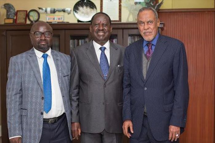 BBI Chairman Yusuf Haji (right), BBI member Adams Oloo (left) with handshake partner Raila Odinga. BBI taskforce makes final announcement on much-awaited Report