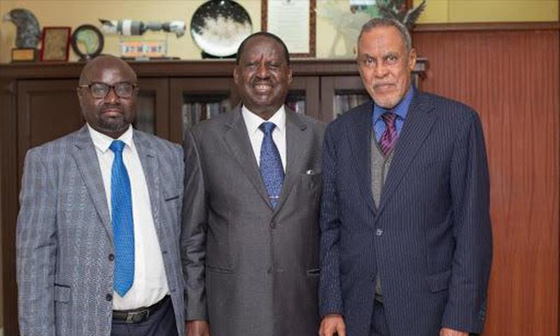 BBI Chairman Yusuf Haji (right), BBI member Adams Oloo (left) with handshake partner Raila Odinga. BBI taskforce makes final announcement on much-awaited Report
