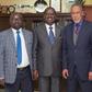 BBI Chairman Yusuf Haji (right), BBI member Adams Oloo (left) with handshake partner Raila Odinga. BBI taskforce makes final announcement on much-awaited Report