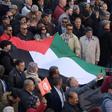 Tunisian demonstrators carry a Palestinian flag during a protest against US President Donald Trump's Middle East peace plan on February 5, 2020