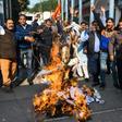 Activists protest against the rape and murder of a 27-year-old woman in India. Police later shod dead the four detained suspects as they re-enacted the crime