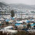 This picture taken on December 12, 2019 shows  a camp for displaced Syrians at Khirbet al-Joz in Syria's Idlib province near Turkey; most of its residents survive on aid brought across the border