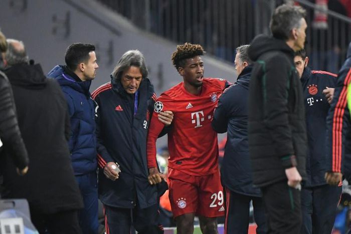 Kingsley Coman (C) was helped off after hurting his knee in Wednesday's 3-1 home win over Tottenham in the Champions League