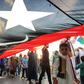 Libyans march in Tripoli with a giant national flag during a September demonstration in support of the UN-recognised government and against strongman Khalifa Haftar who has led an offensive on the capital city since April
