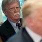 Trump's denial came after The New York Times reported that his former national security advisor John Bolton (L) says in his upcoming book that the president tied Ukraine aid to an investigation of his rivals