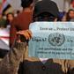 A demonstrator in Baghdad's Tahrir Square appeals for protection after a night of violence blamed on supporters of populist cleric Moqtada Sadr