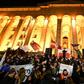 Protesters demanding the government's resignation and early parliamentary polls rally in front of the parliament in Tbilisi