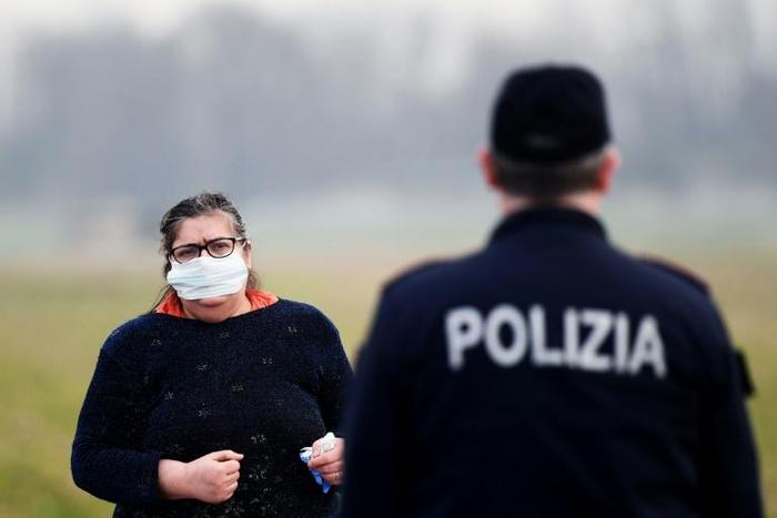 Police setting up checkpoints said they would enforce a blockade which Italy's prime minister warned could last for weeks