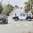 Police cars block access to a road near a courthouse in the Algerian city of Blida where an appeal hearing is underway in the trial of the brother of former president Abdelaziz Bouteflika and three other key figures