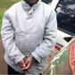 File image of a suspect during a past arrest. A police officer linked to the rape of university student whose hand was chopped off has been arrested