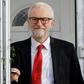 Corbyn defended his far-left campaign platform and gave no clear indication of when he might step down