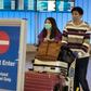 Passengers wearing protective masks arriving at Los Angeles International Airport in California