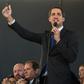 Venezuelan opposition leader Juan Guaido addresses a news conference, flanked by opposition lawmakers and supporters, after being sworn in for a new term as National Assembly leader