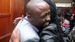 File image of Joseph Jowie Irungu hugging a female relative in court