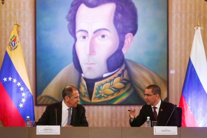 Russian Foreign Minister Sergei Lavrov (L) speaks with his Venezuelan counterpart Jorge Arreaza (R) at the Foreign Affairs Ministry in Caracas on February 7, 2020