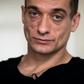 Russian artist Pyotr Pavlensky poses during a press interview with AFP at his lawyer's office in Paris on February 14, 2020.Pavlensky was placed in custody on February 15, 2020 as part of an investigation for violence on December 31, 2019.
Emmanuel Mac...