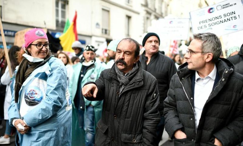 Philippe Martinez, centre, head of France's CGT labour union, at a hospital workers strike in Paris in November. He called the government's pension reform plan a "flagrant provocation."