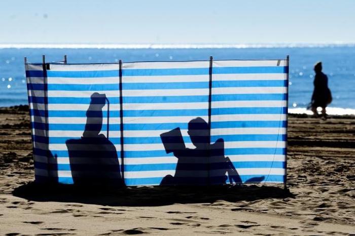 British residents and tourists bask in the sun on Spain's east coast -- but away from the beach, many say they are concerned about their future with Brexit now a reality