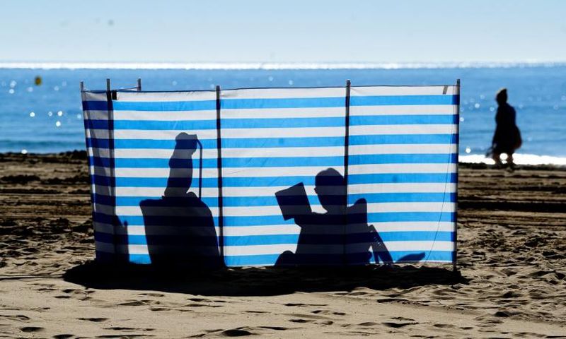British residents and tourists bask in the sun on Spain's east coast -- but away from the beach, many say they are concerned about their future with Brexit now a reality