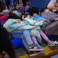Venezuelan migrants wait to get a refugee application at a Peruvian border post in June 14 2019: the US Treasury has accused the head of a Venezuela government agency of seeling off passports for bribes