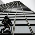 Alain Robert made his own protest to France's planned pension reforms by scaling the Total tower just outside Paris on Monday.