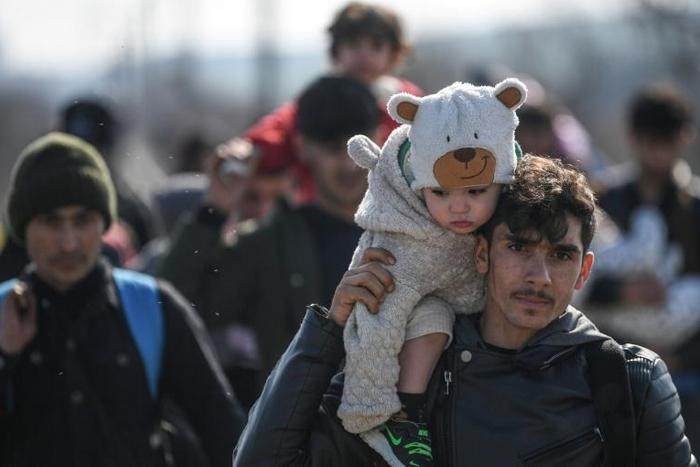 Some 13,000 migrants have amassed at the Turkey-Greece border, including families with young children who spent the night in the cold