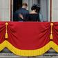 (FILES) In this file photo taken on July 10, 2018 Britain's Meghan, Duchess of Sussex (R) puts her hand on Britain's Prince Harry, Duke of Sussex's back; Britain's Prince Harry and his wife Meghan will give up their titles and stop receiving public fun...