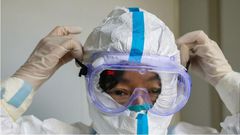 File image of a person wearing a protective facemask